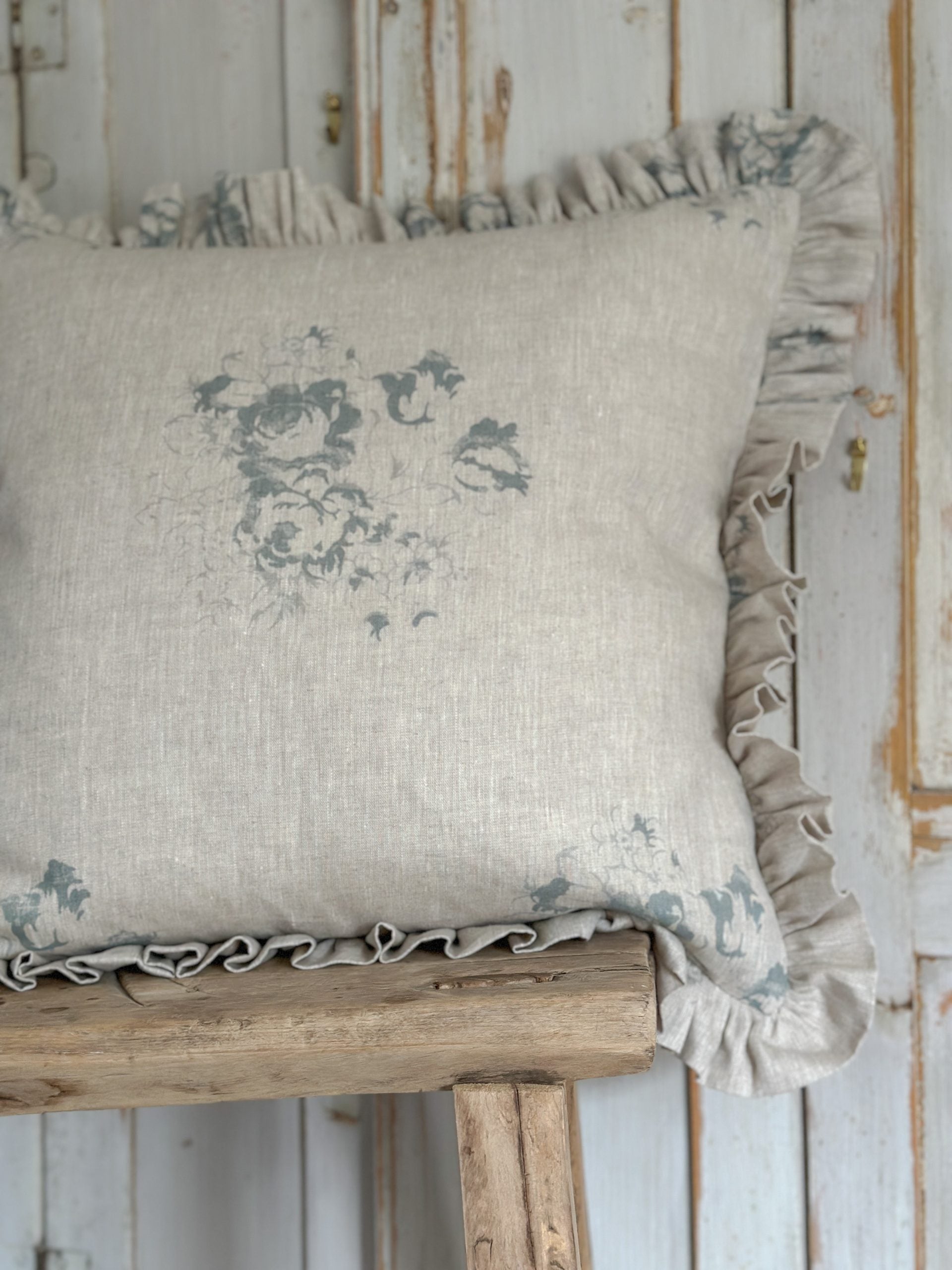 Hatley blue on natural frilled cushion