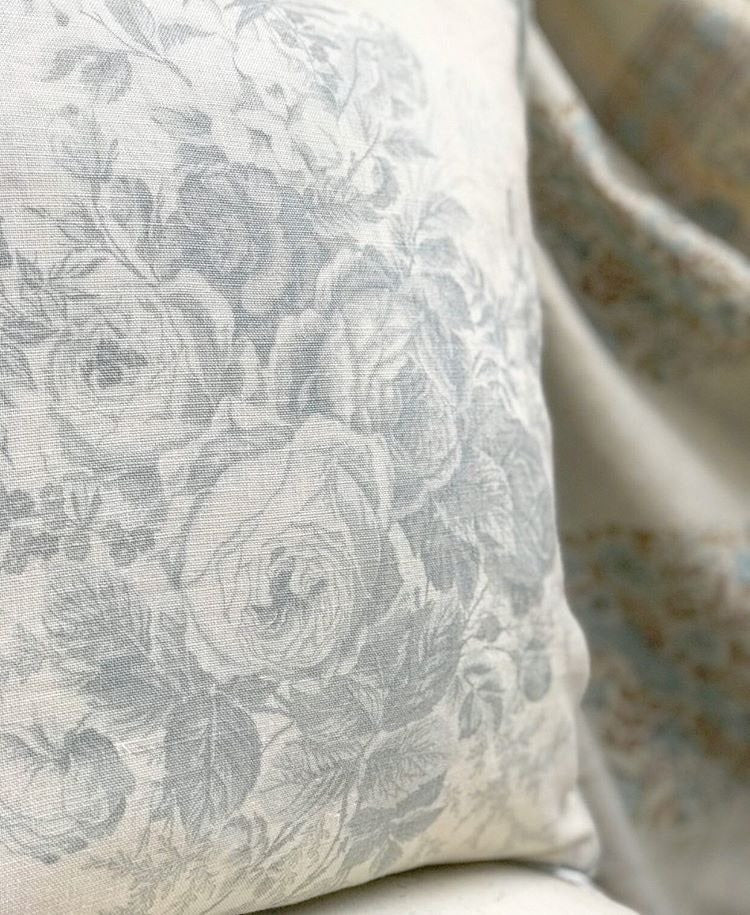 Kate Forman blue roses cushion with velvet pipe