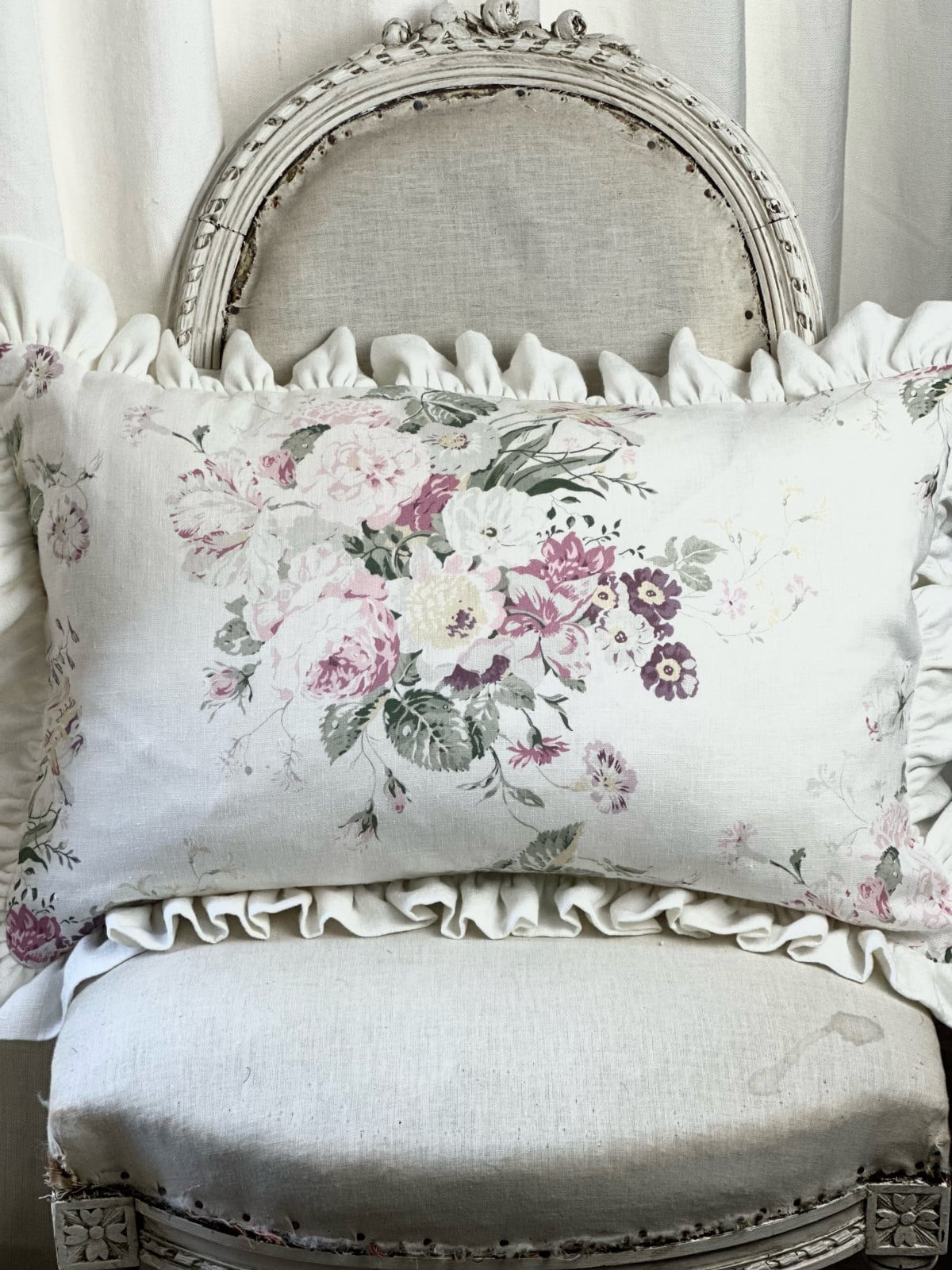 Constance on white frilled cushion