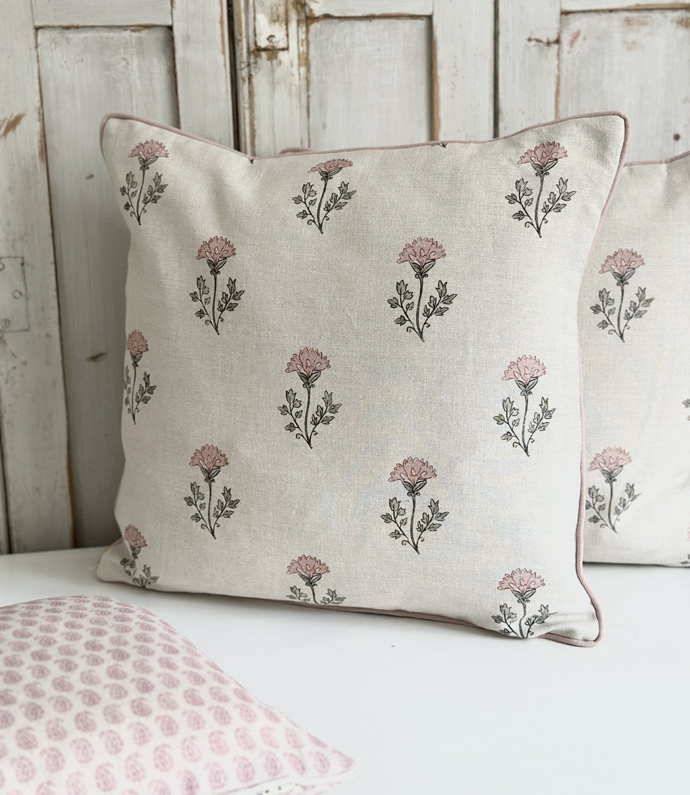 Thea pink on ivory linen cushion