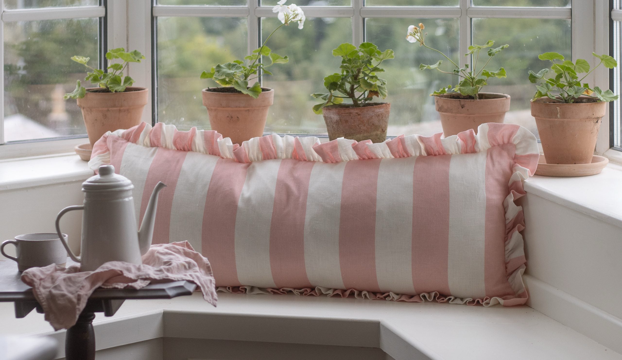 Wide stripe frilled lumber cushion